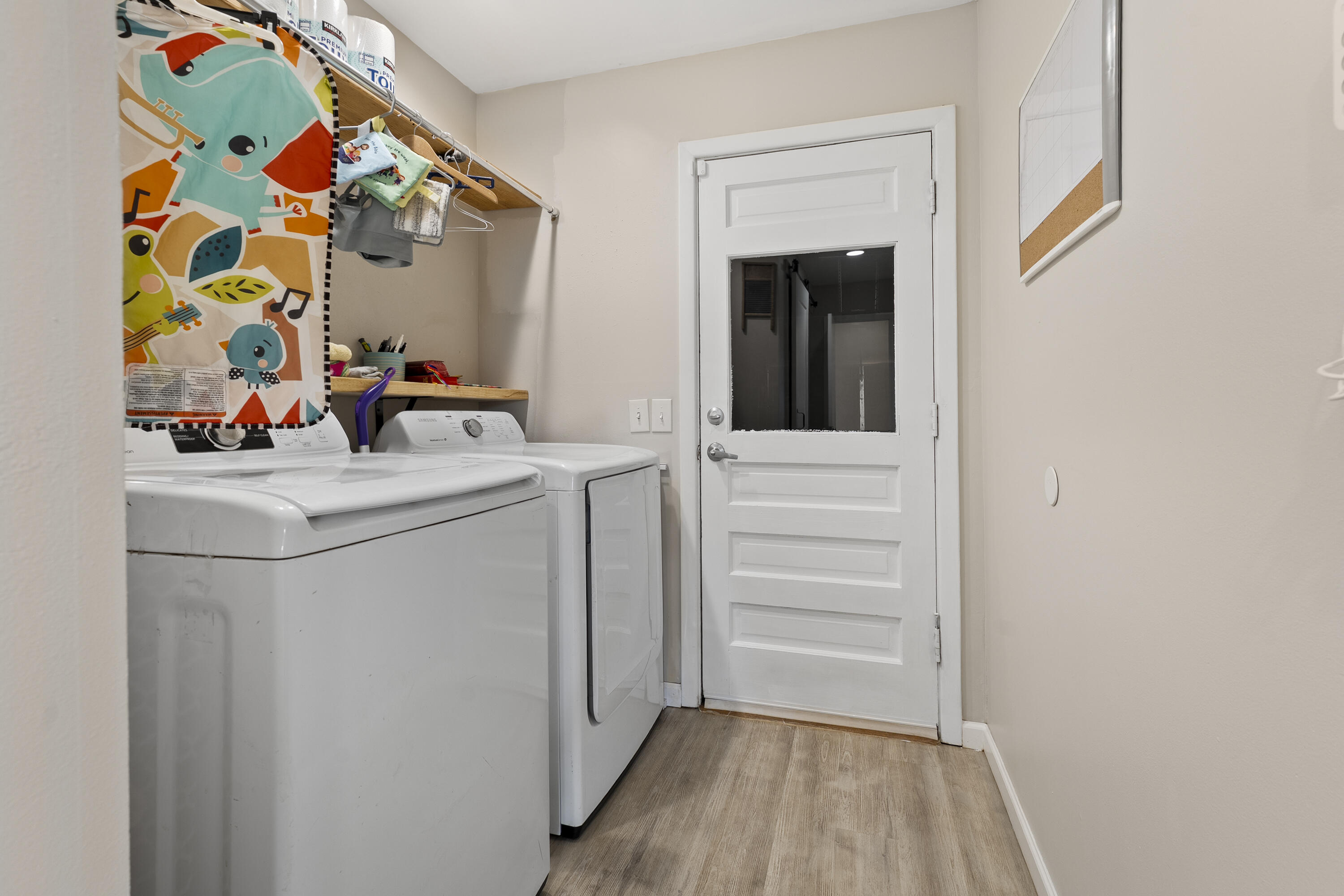 3703 41st Street Lubbock, TX 79413 - Photo 18 of 21 a view of storage and utility room with washer and dryer