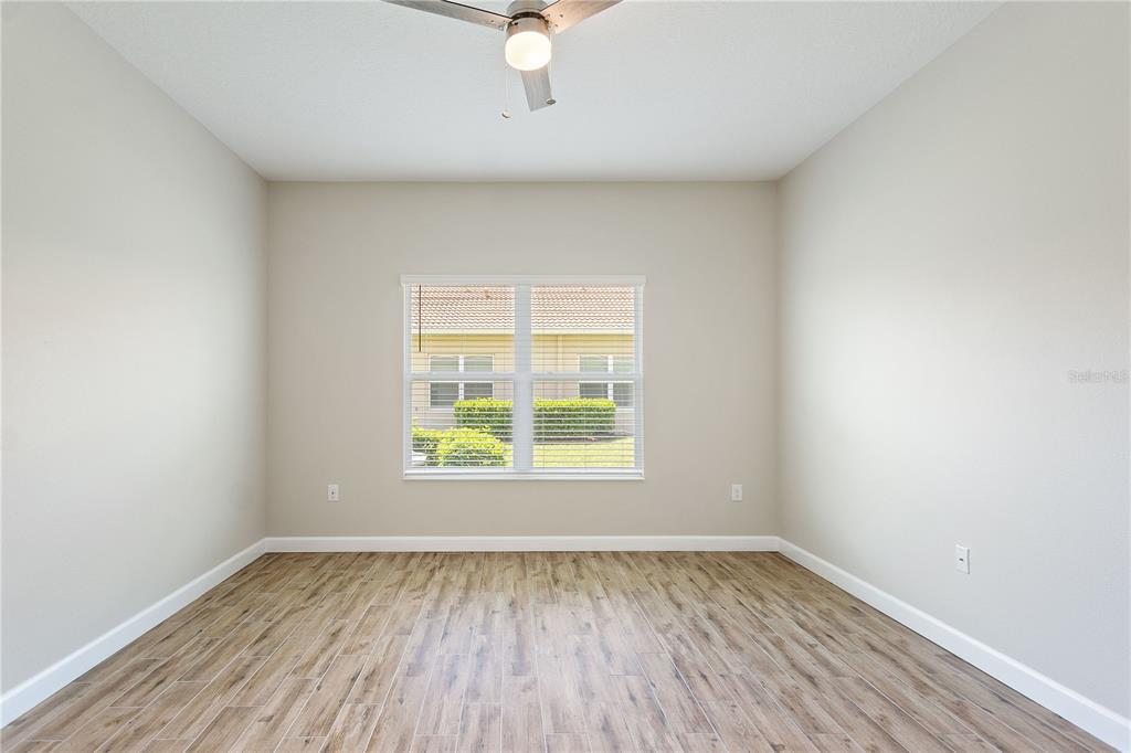 1064 Blackwolf Run Road Davenport, FL 33896 - Photo 12 of 38 an empty room with a window