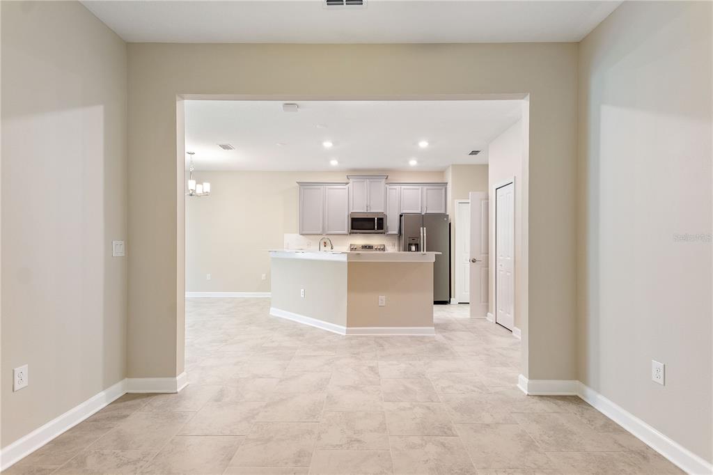 1064 Blackwolf Run Road Davenport, FL 33896 - Photo 15 of 38 a view of a kitchen with a sink