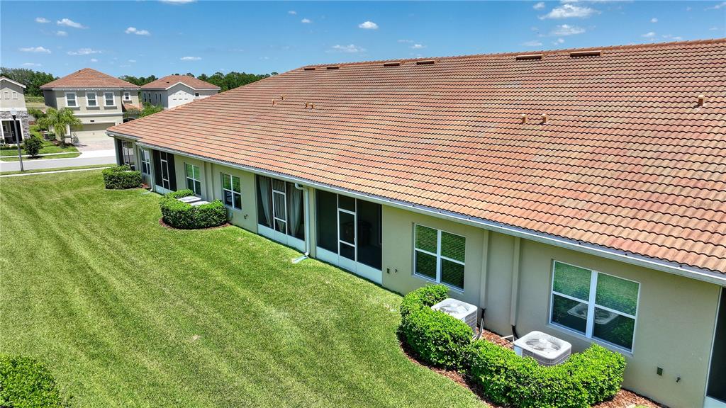 1064 Blackwolf Run Road Davenport, FL 33896 - Photo 20 of 38 a front view of a house with garden
