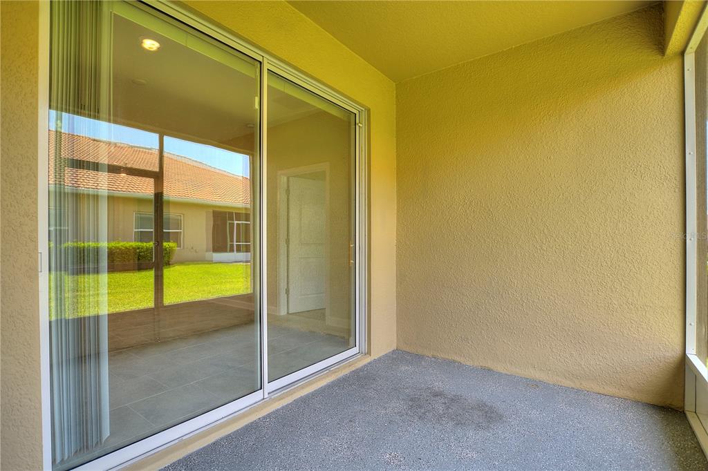 1064 Blackwolf Run Road Davenport, FL 33896 - Photo 21 of 38 a view of a glass door
