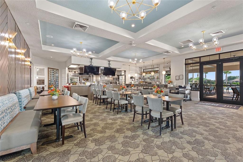 1064 Blackwolf Run Road Davenport, FL 33896 - Photo 30 of 38 a view of a dining room with furniture