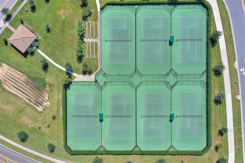 1064 Blackwolf Run Road Davenport, FL 33896 - Photo 37 of 38 a bathroom with a glass shower door