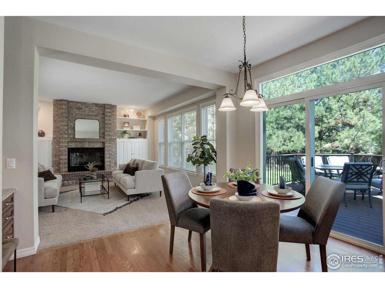 5218 Pinehurst Drive Boulder, CO 80301 - Photo 13 of 39 a dining room with furniture window and wooden floor