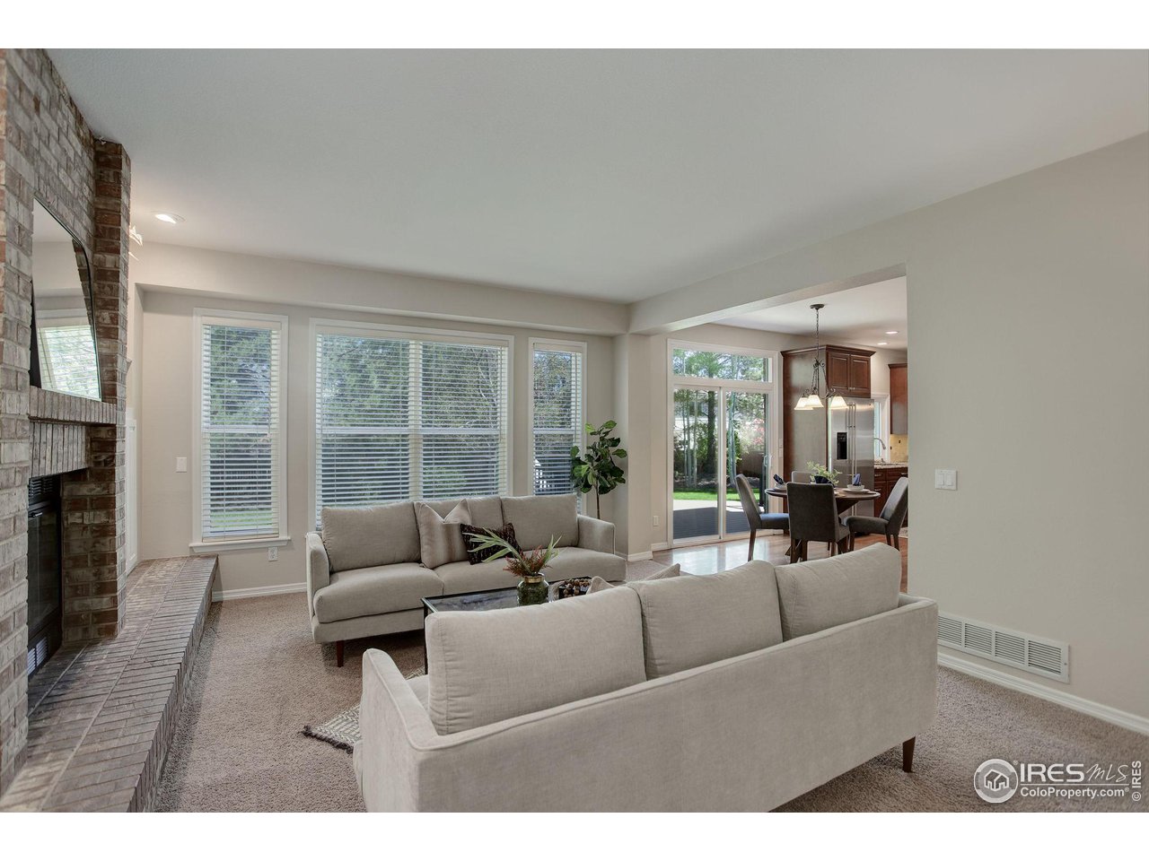 5218 Pinehurst Drive Boulder, CO 80301 - Photo 14 of 39 a living room with furniture and a fireplace
