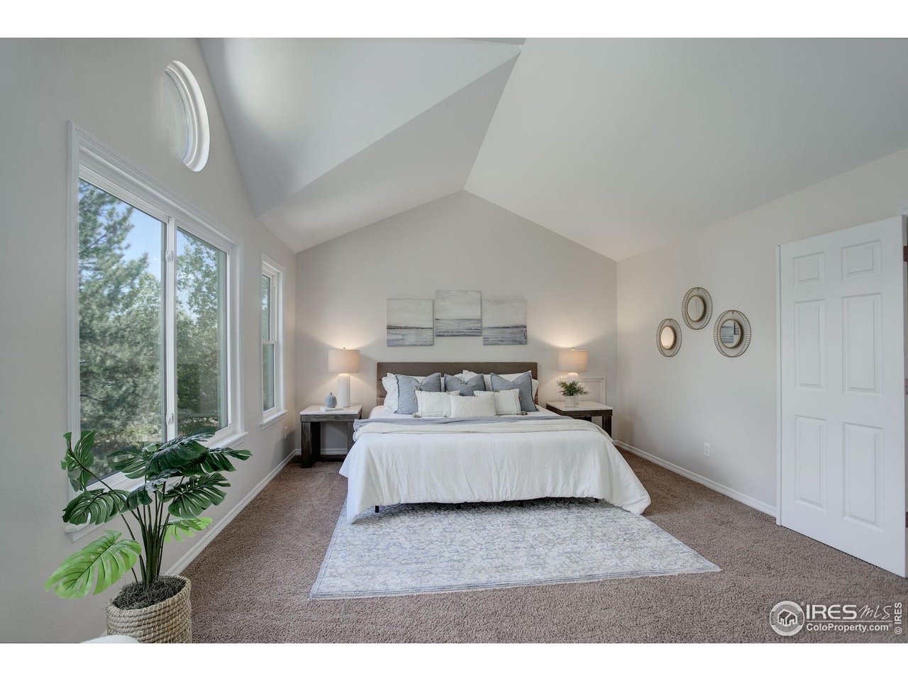 5218 Pinehurst Drive Boulder, CO 80301 - Photo 17 of 39 a bedroom with a large bed and a large window