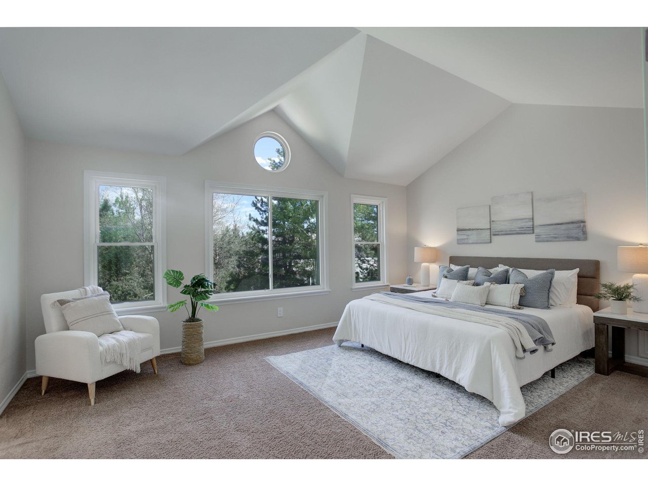 5218 Pinehurst Drive Boulder, CO 80301 - Photo 20 of 39 a spacious bedroom with a bed and glass window