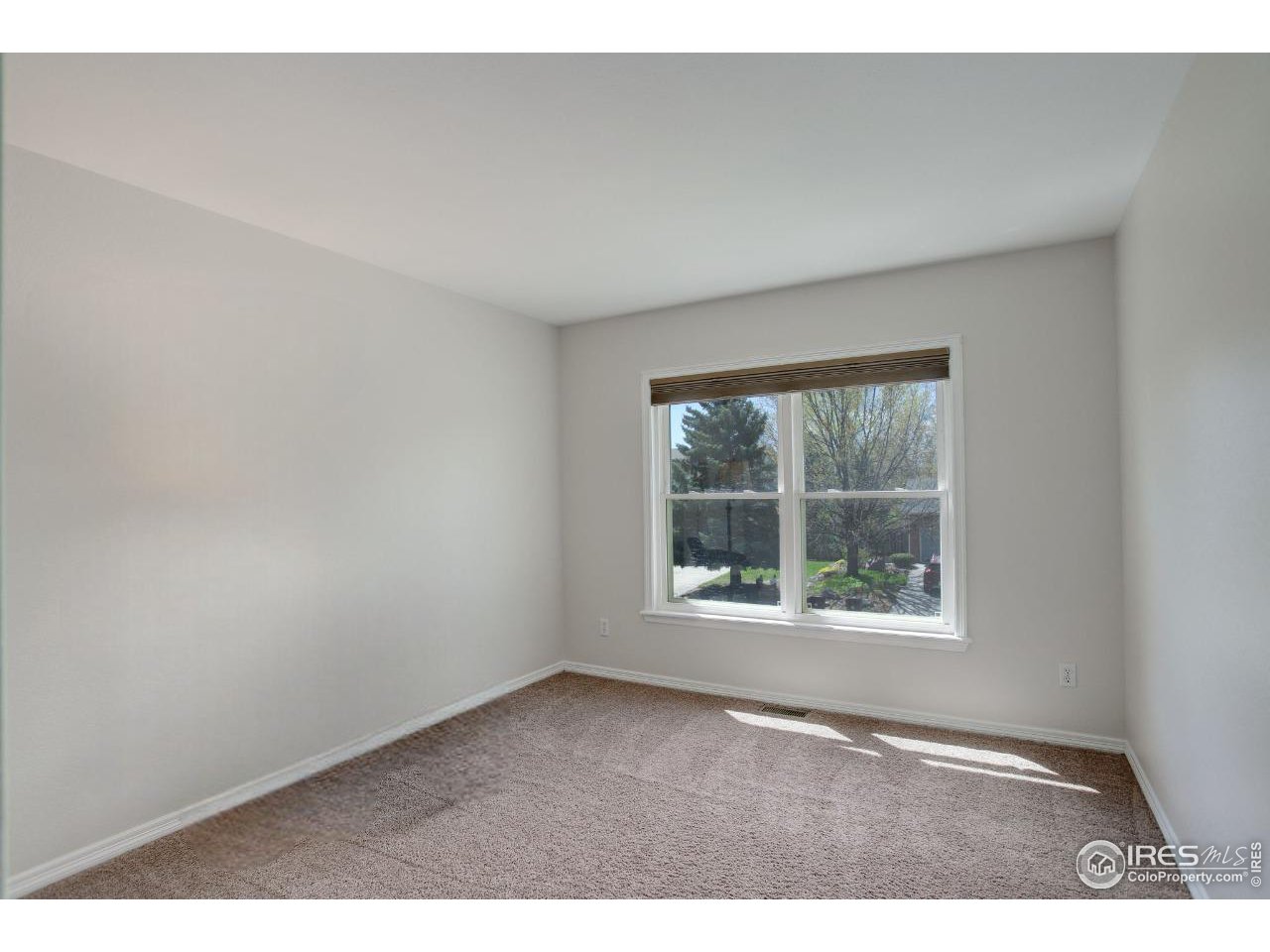 5218 Pinehurst Drive Boulder, CO 80301 - Photo 21 of 39 an empty room with a window
