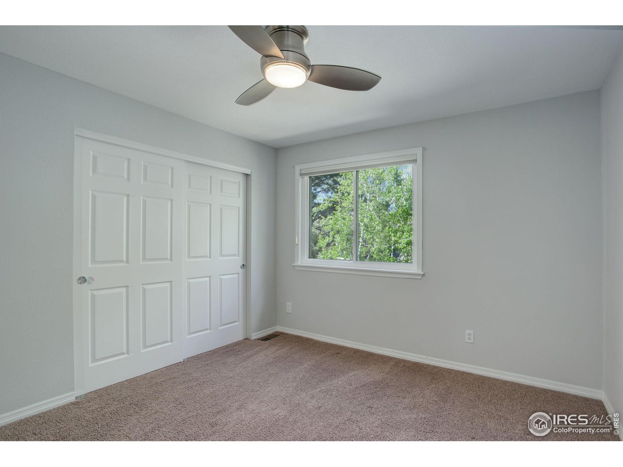5218 Pinehurst Drive Boulder, CO 80301 - Photo 23 of 39 a view of an empty room with a window