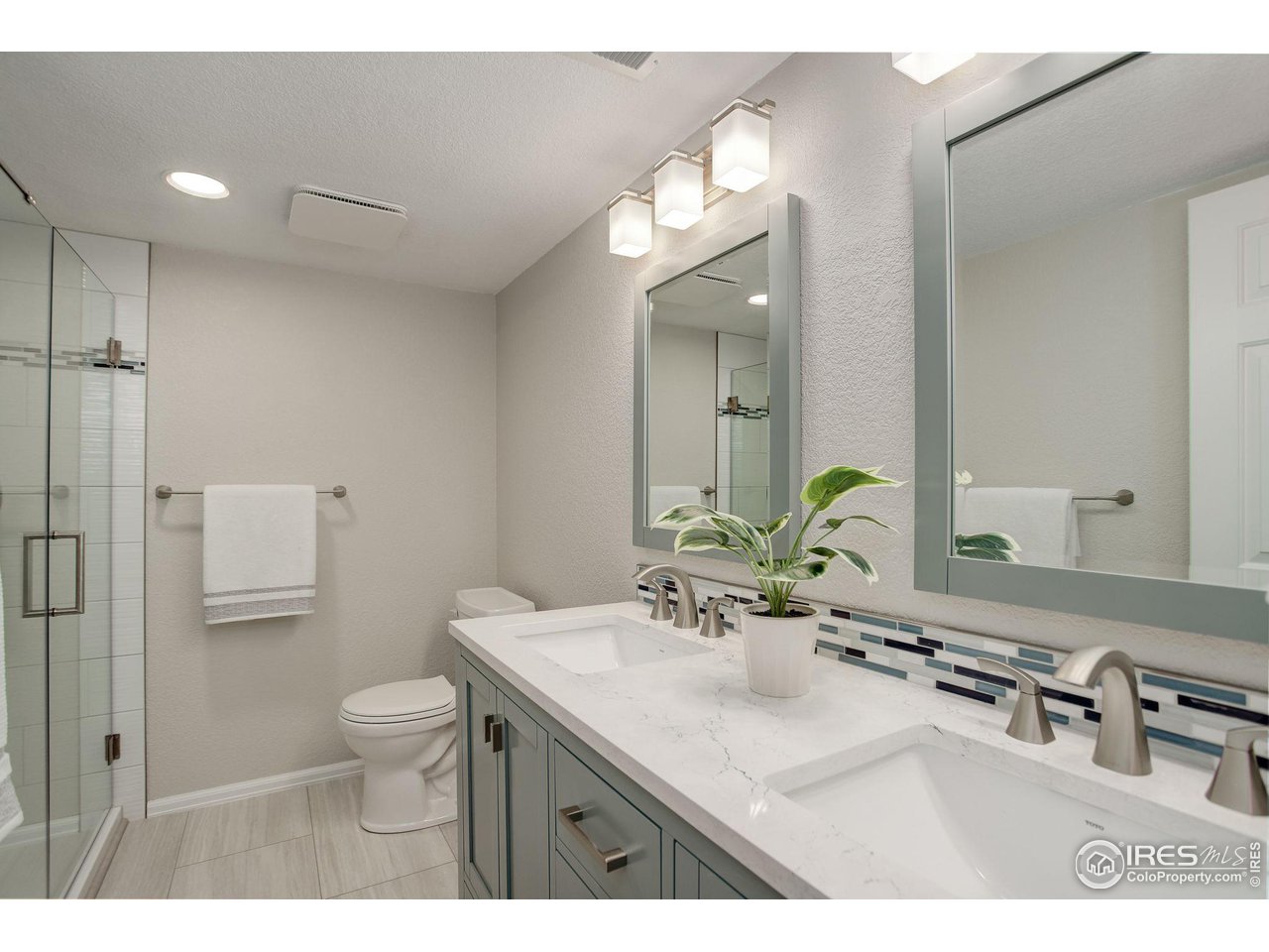 5218 Pinehurst Drive Boulder, CO 80301 - Photo 25 of 39 a bathroom with a sink double vanity and a mirror