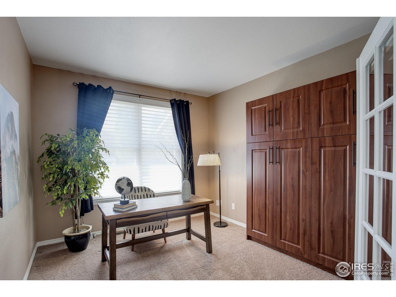 5218 Pinehurst Drive Boulder, CO 80301 - Photo 26 of 39 a living room with furniture and a potted plant