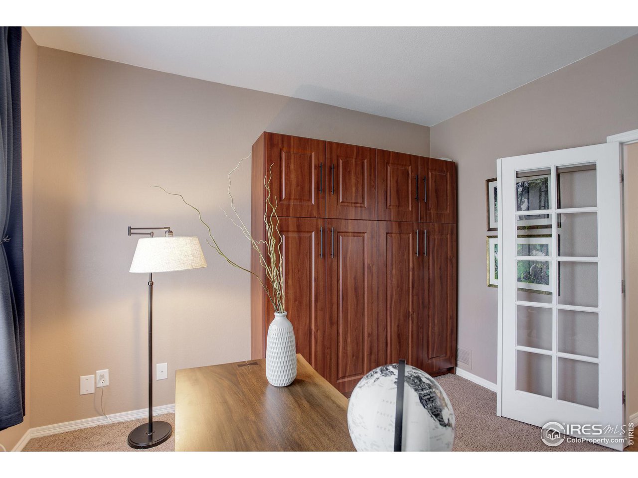 5218 Pinehurst Drive Boulder, CO 80301 - Photo 27 of 39 a view of an empty room with wooden floor and closet