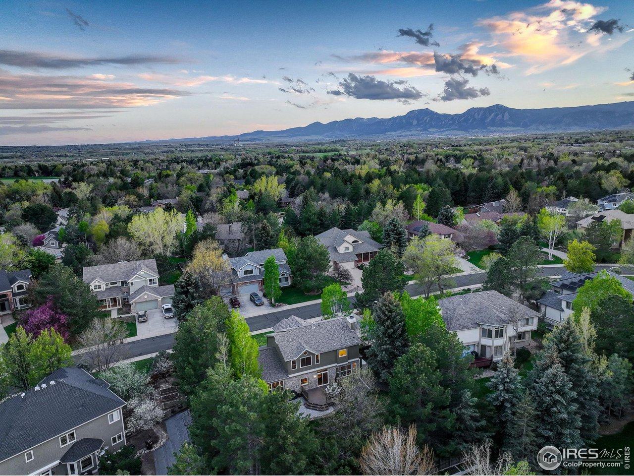 5218 Pinehurst Drive Boulder, CO 80301 - Photo 37 of 39 an aerial view of a city with lots of residential buildings green landscape and mountain view