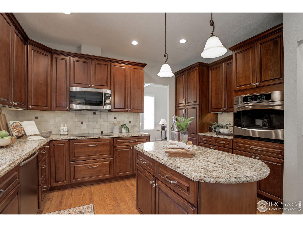 5218 Pinehurst Drive Boulder, CO 80301 - Photo 8 of 39 a kitchen with stainless steel appliances granite countertop a sink stove and microwave