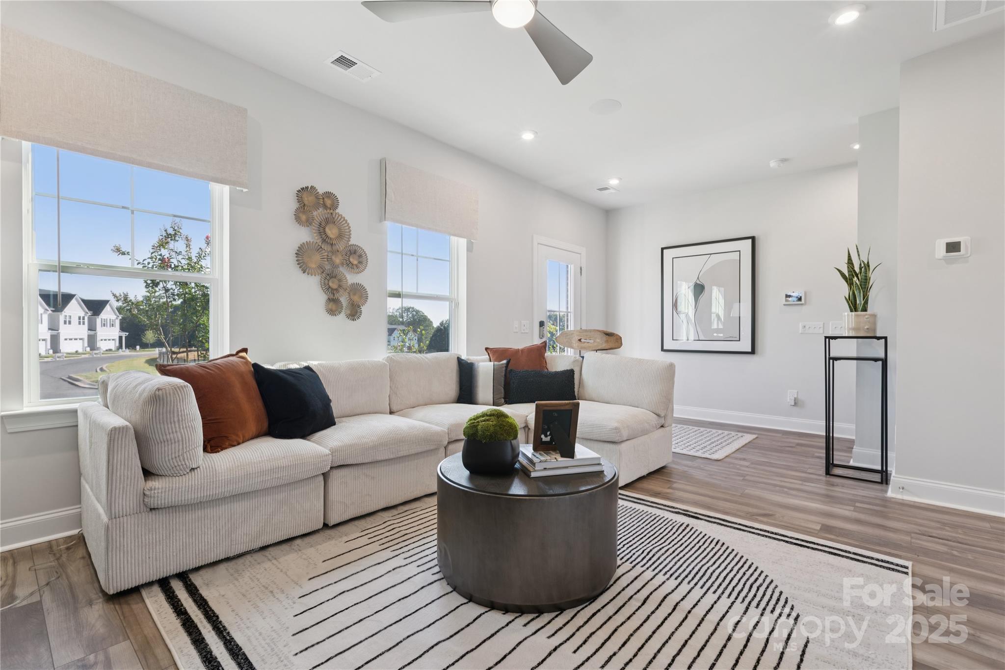 1828 Viewfield Road Fort Mill, SC 29708 - Photo 22 of 33 a living room with furniture and a potted plant
