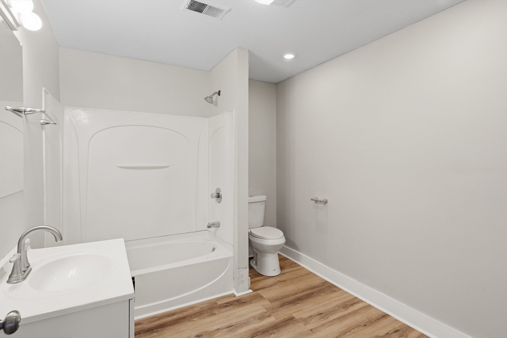 834 Worthington Street, Unit 2 Springfield, MA 01105 - Photo 7 of 20 a bathroom with a sink and a toilet