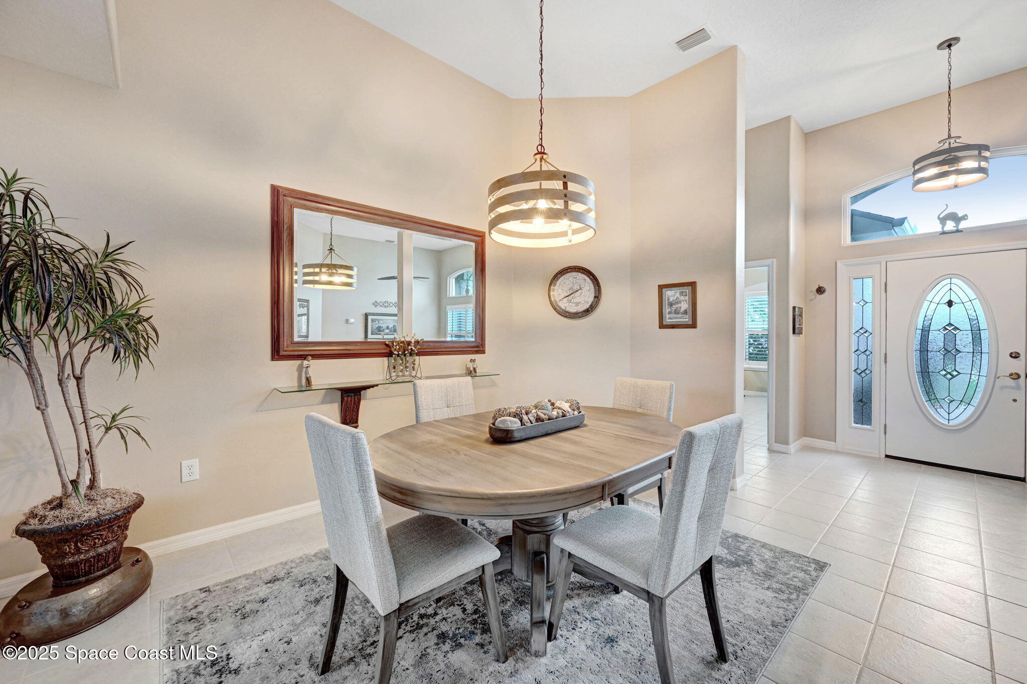1692 Long Pine Road Melbourne, FL 32940 - Photo 11 of 43 a view of a dining room with furniture and wooden floor