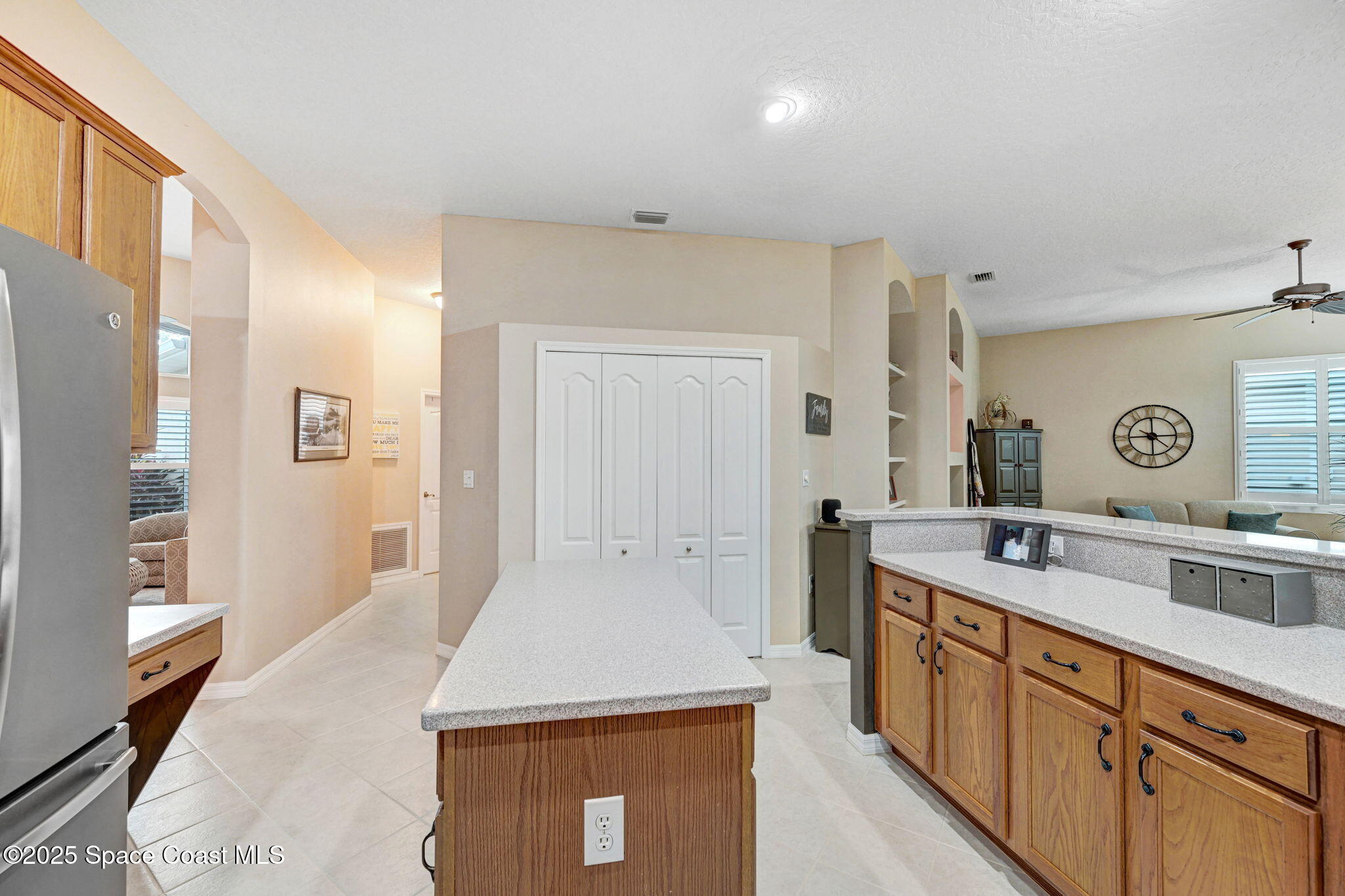1692 Long Pine Road Melbourne, FL 32940 - Photo 15 of 43 a kitchen with a sink and a refrigerator