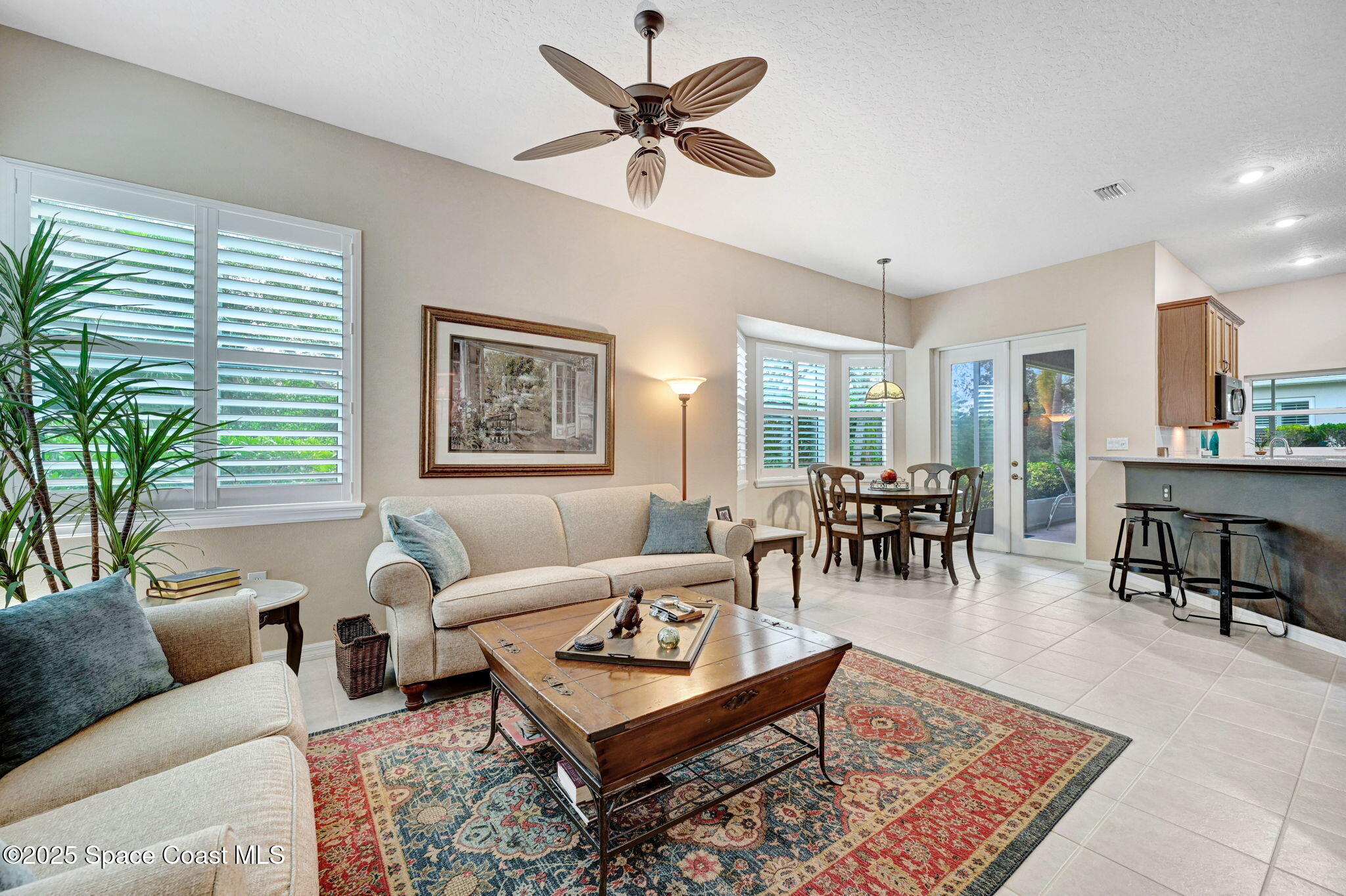 1692 Long Pine Road Melbourne, FL 32940 - Photo 18 of 43 a living room with furniture a table and a large window
