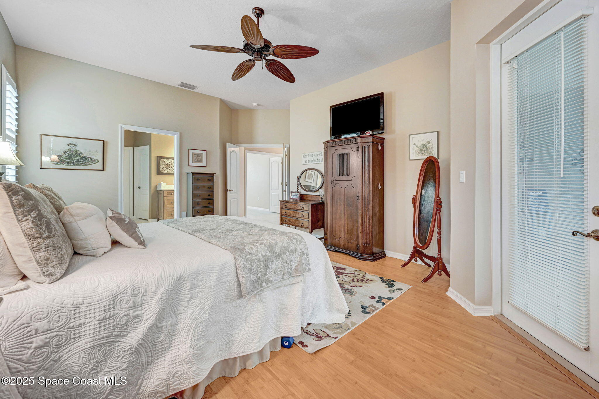 1692 Long Pine Road Melbourne, FL 32940 - Photo 25 of 43 a bed room with a bed a television and a window