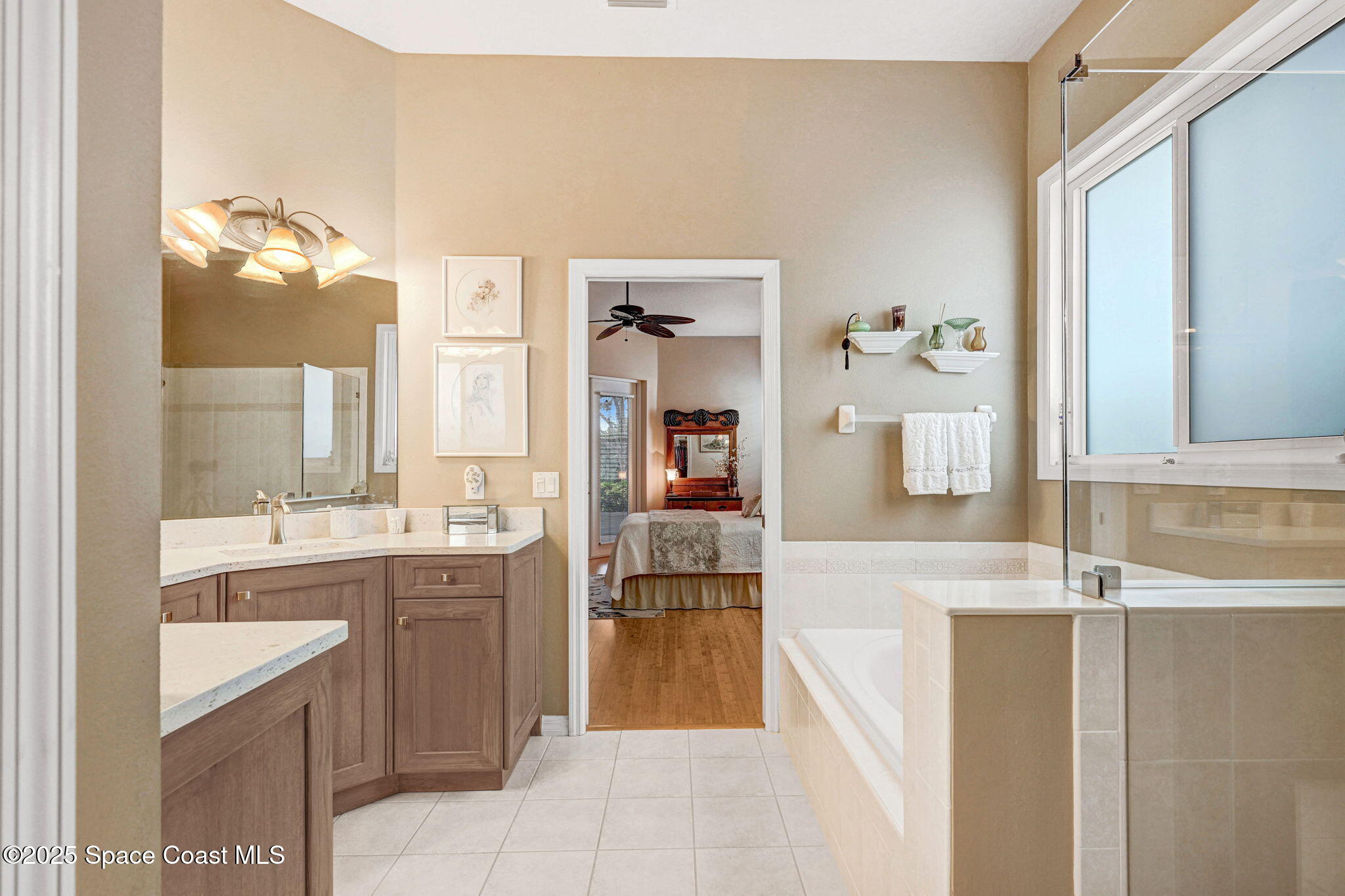 1692 Long Pine Road Melbourne, FL 32940 - Photo 28 of 43 a bathroom with a sink and a mirror
