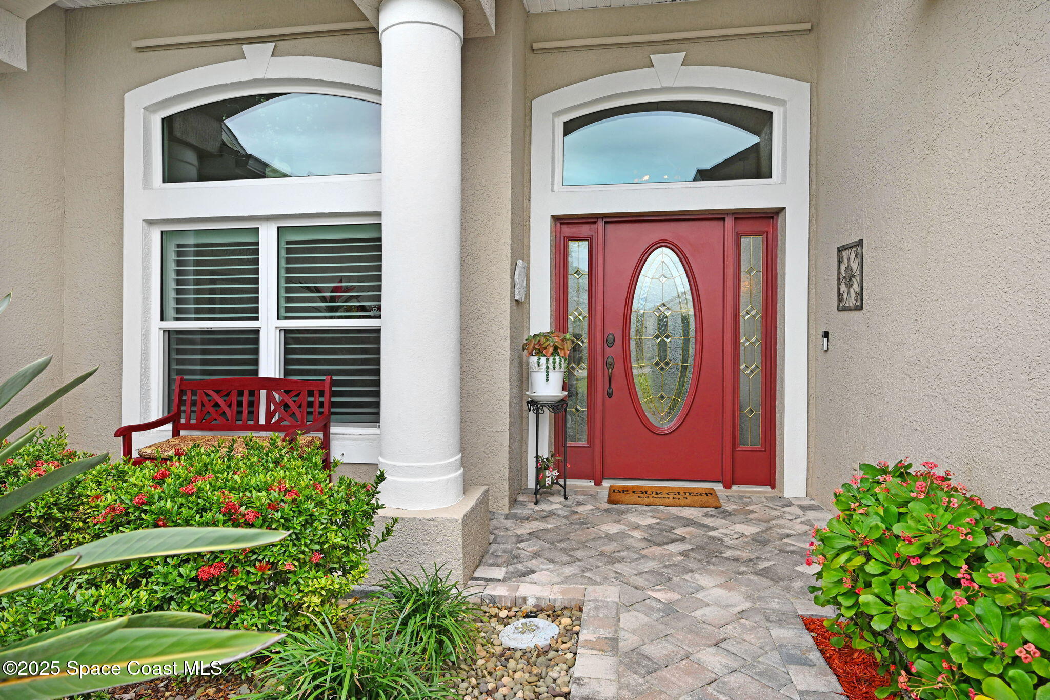 1692 Long Pine Road Melbourne, FL 32940 - Photo 3 of 43 a front view of a house with garden
