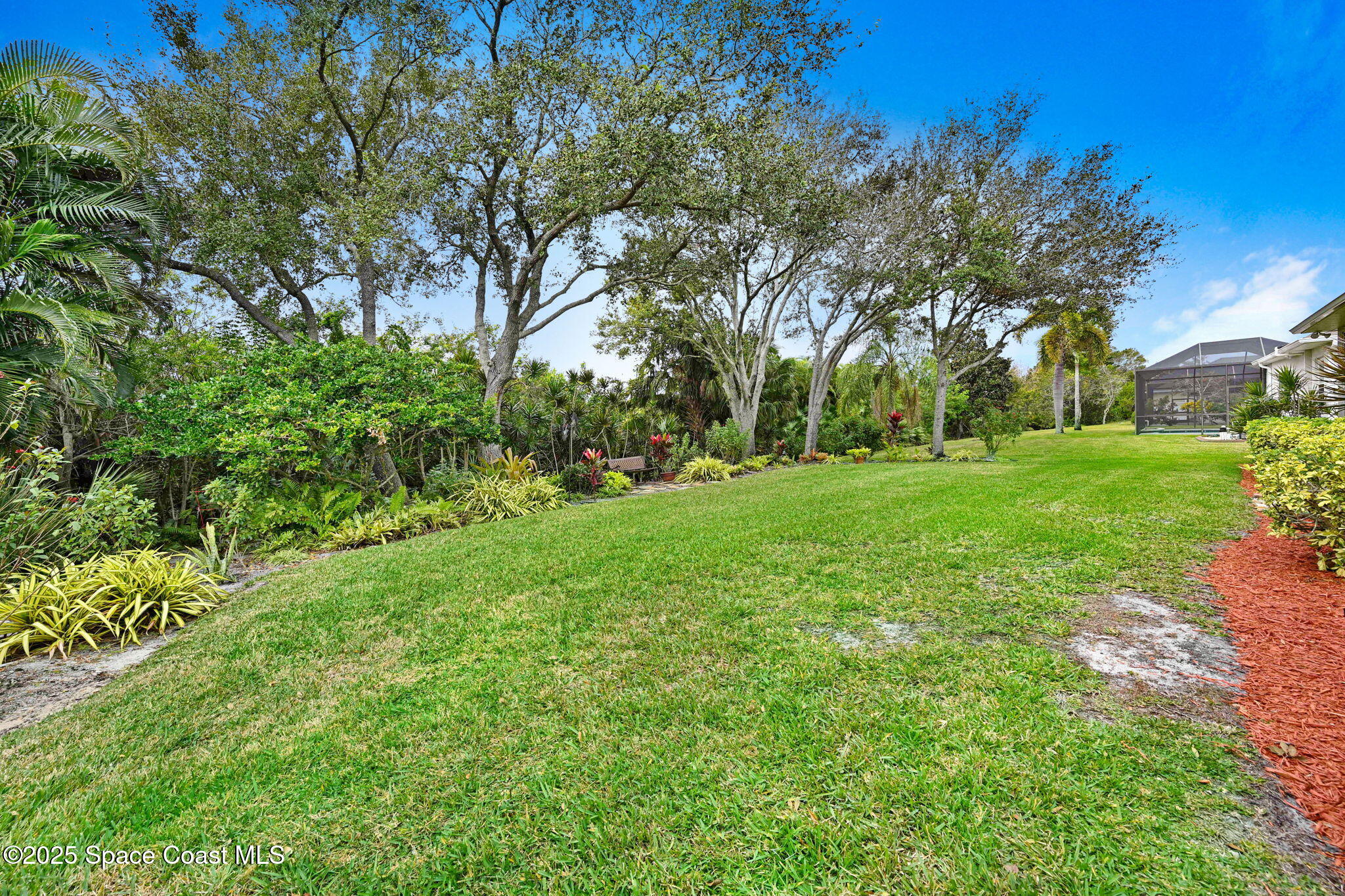 1692 Long Pine Road Melbourne, FL 32940 - Photo 39 of 43 a view of a grassy field with trees
