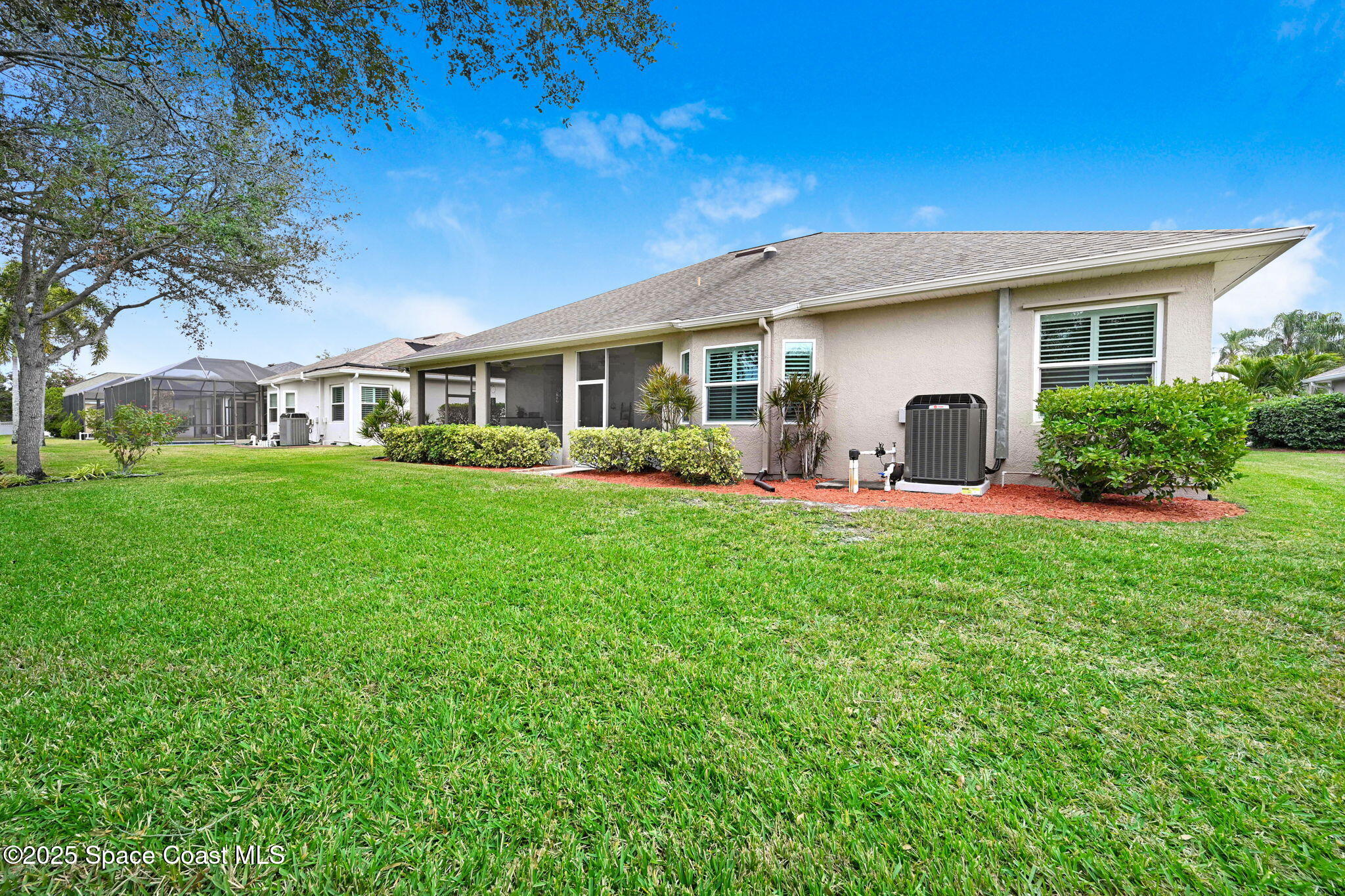 1692 Long Pine Road Melbourne, FL 32940 - Photo 40 of 43 a front view of house with yard and green space
