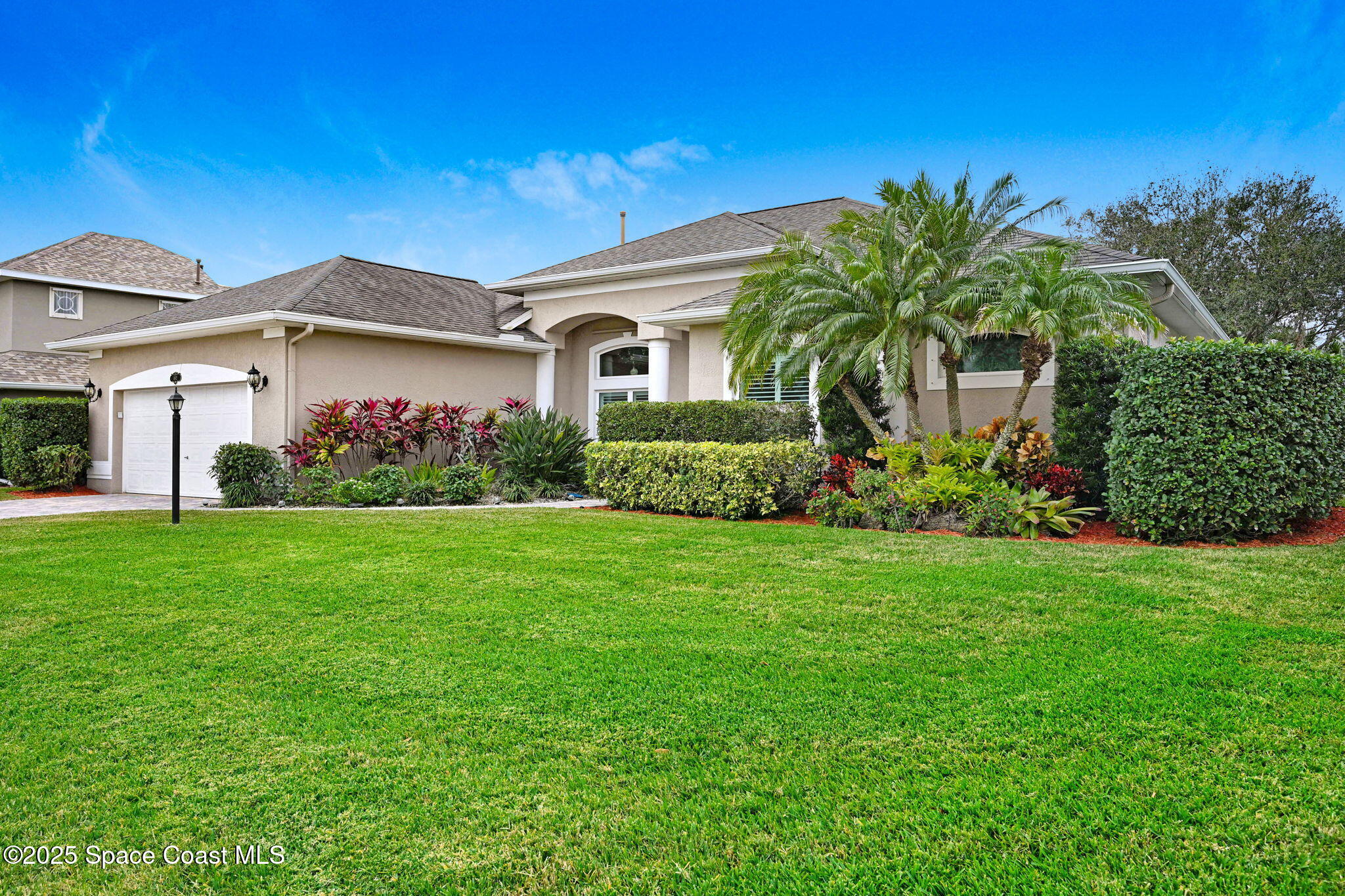 1692 Long Pine Road Melbourne, FL 32940 - Photo 4 of 43 a front view of house with yard and green space