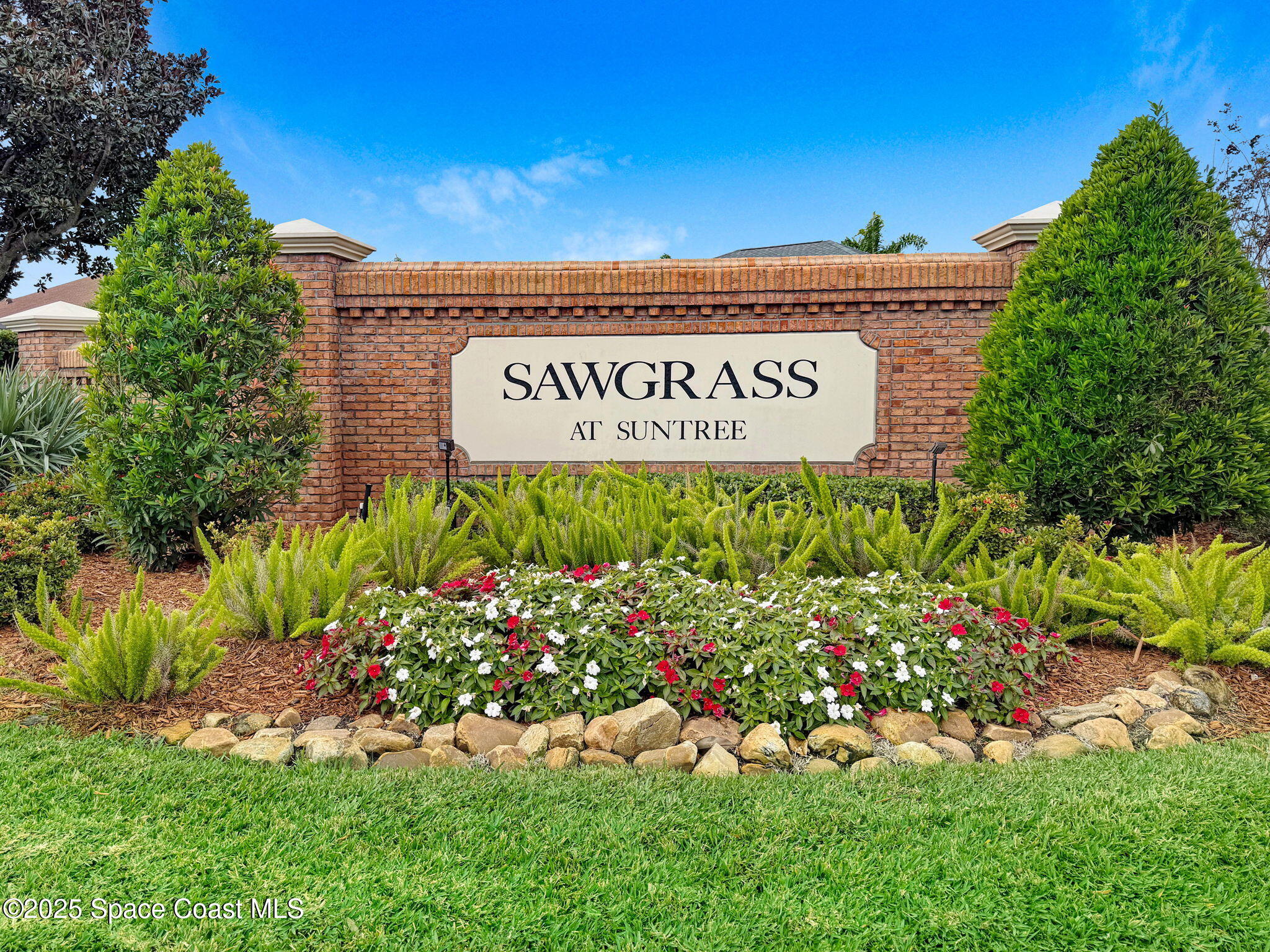 1692 Long Pine Road Melbourne, FL 32940 - Photo 43 of 43 a view of a sign board with flower plants