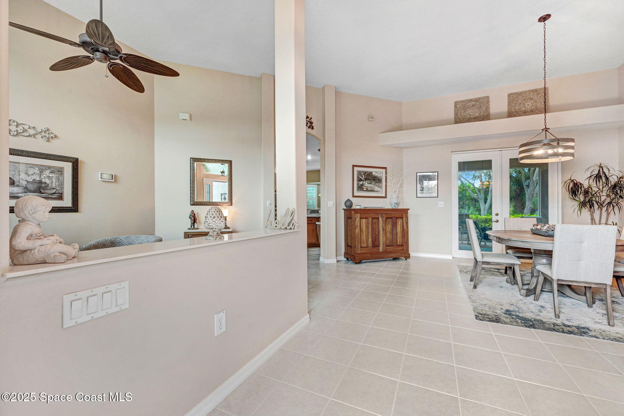 1692 Long Pine Road Melbourne, FL 32940 - Photo 5 of 43 a living room with furniture and a dining table