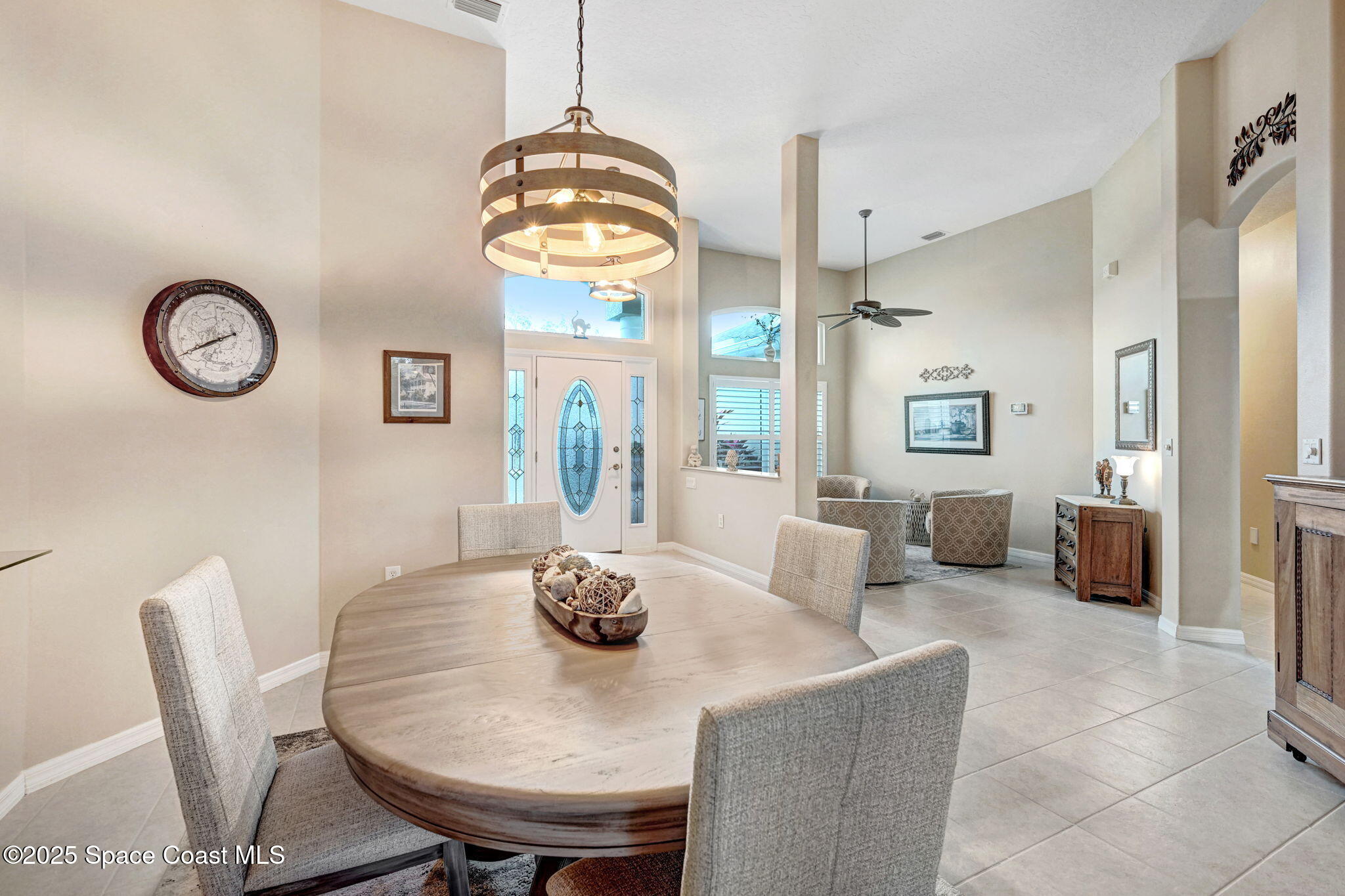 1692 Long Pine Road Melbourne, FL 32940 - Photo 10 of 43 a view of a dining room with furniture window and wooden floor