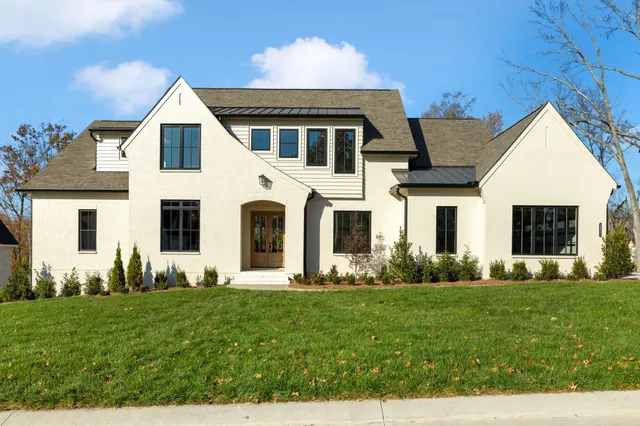 a front view of a house with a yard