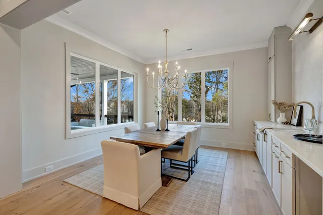 a kitchen with stainless steel appliances a sink a stove a microwave and cabinets