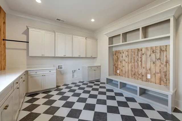 a spacious bathroom with a tub sink and mirror