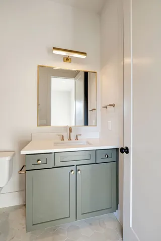 a view of a ceiling fan and a window in a room
