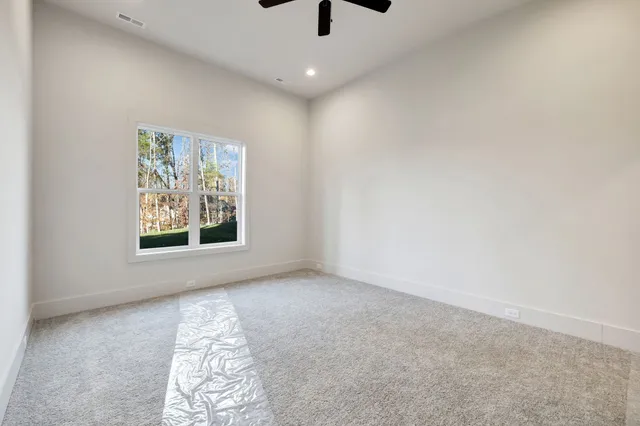 a view of a house with backyard