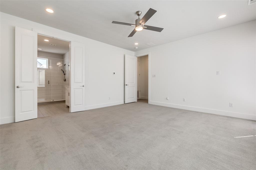 1119 Lavender Ridge Dallas, TX 75204 - Photo 11 of 24 Enjoy the space of this spacious primary escape covering the entire third floor of the home complete with double vanity, large walk in closet, and private balcony.