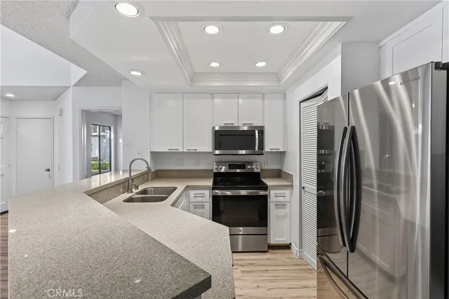a kitchen that has a sink and a stove
