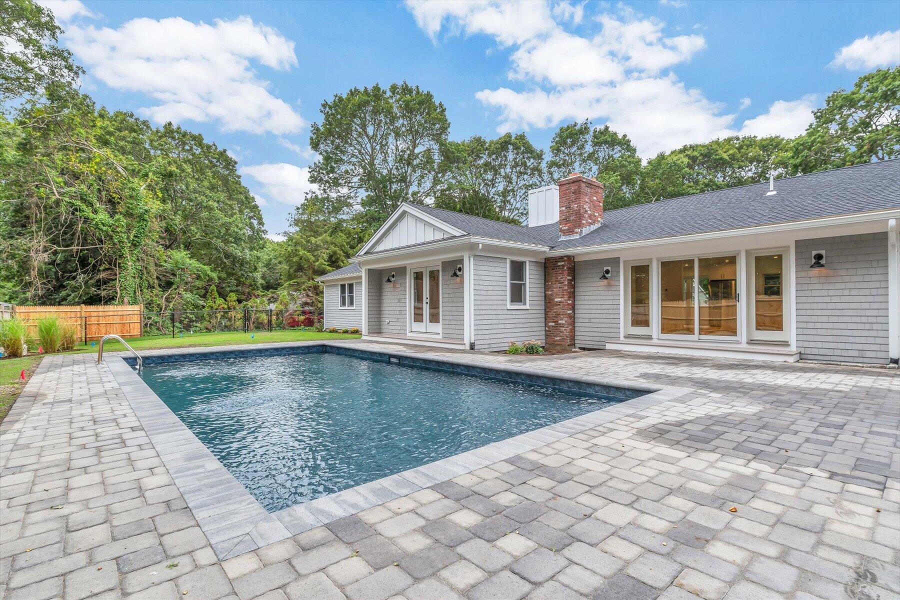 40 Sachem Drive Centerville, MA 02632 - Photo 11 of 56 a view of a house with a swimming pool