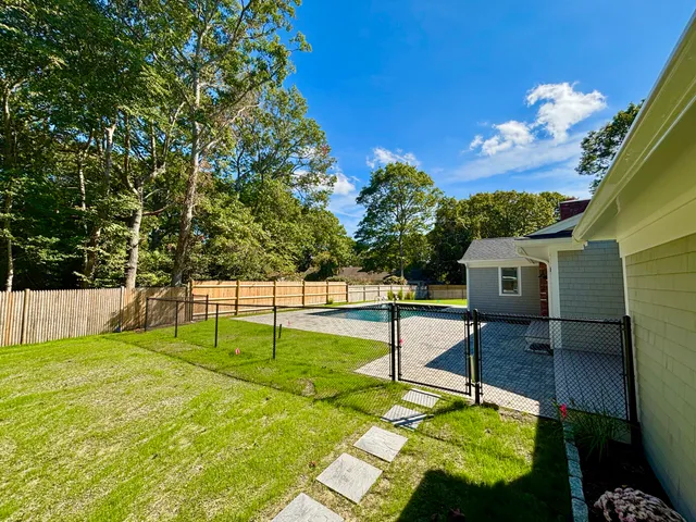 a dining room with furniture a rug and wooden floor