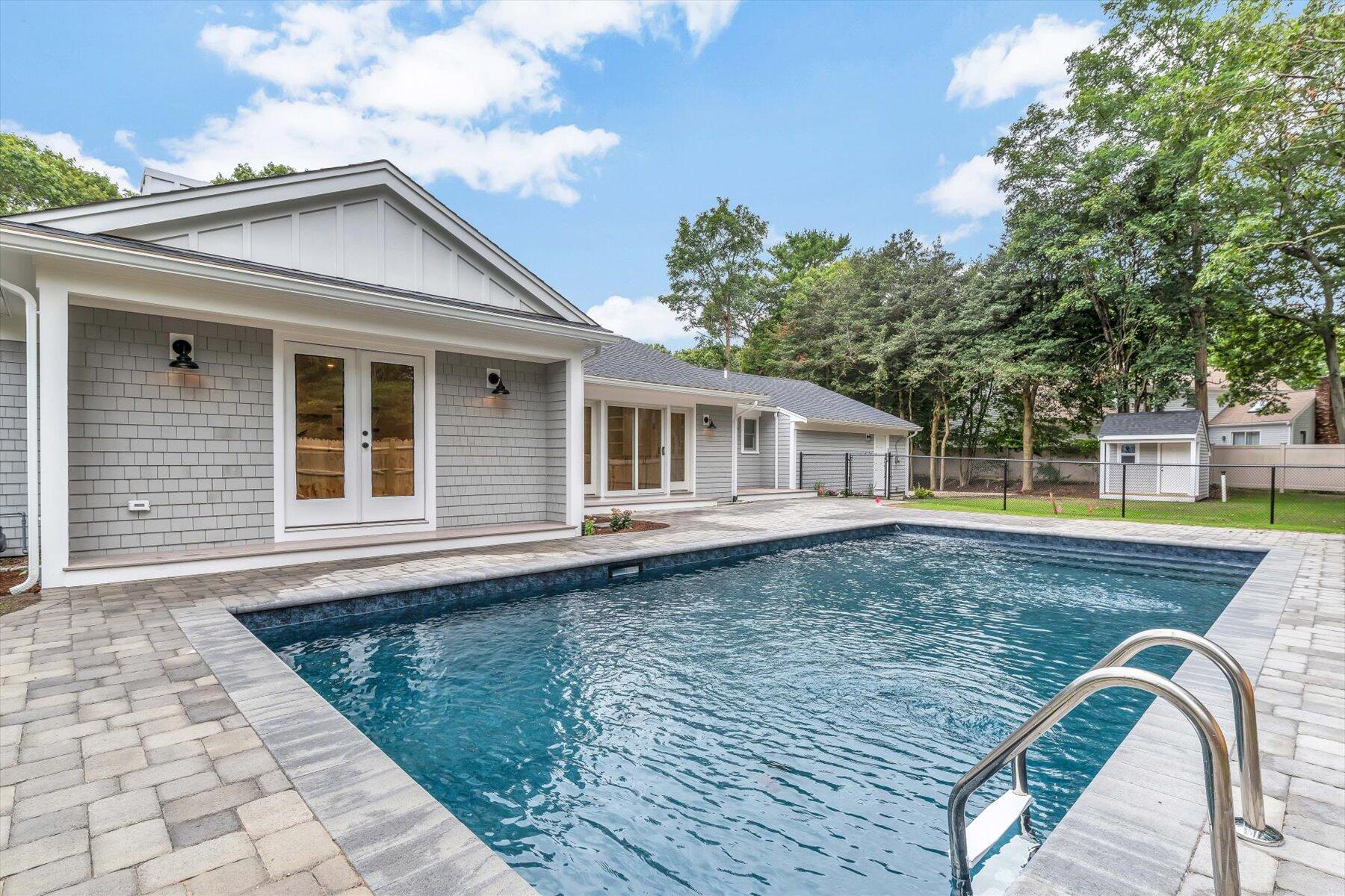40 Sachem Drive Centerville, MA 02632 - Photo 15 of 56 a view of a house with a swimming pool
