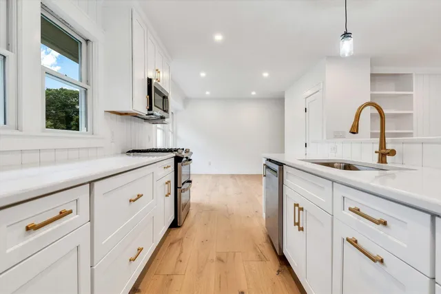 wooden floor in a hall with an entryway