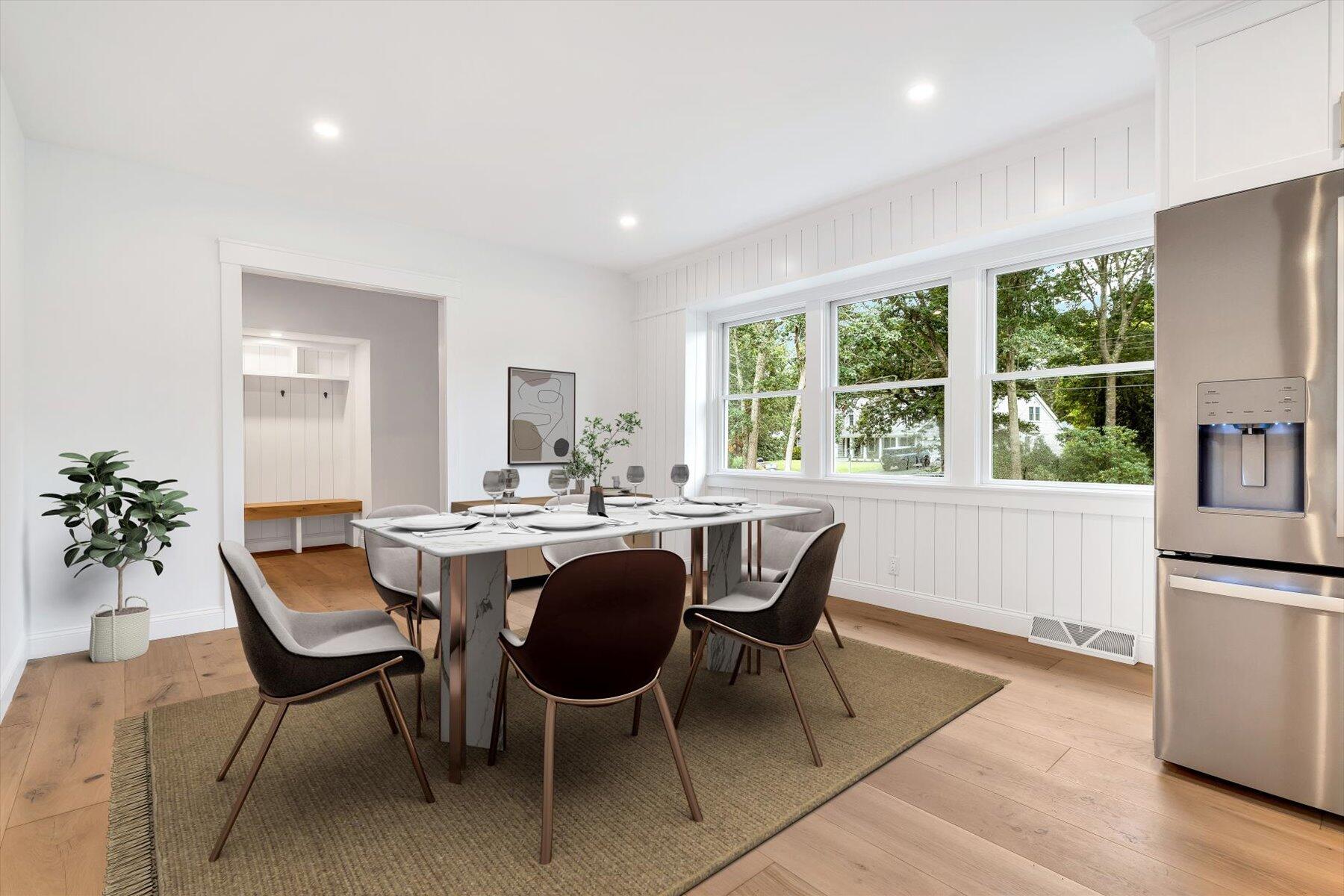 40 Sachem Drive Centerville, MA 02632 - Photo 20 of 56 a dining room with furniture a rug and wooden floor