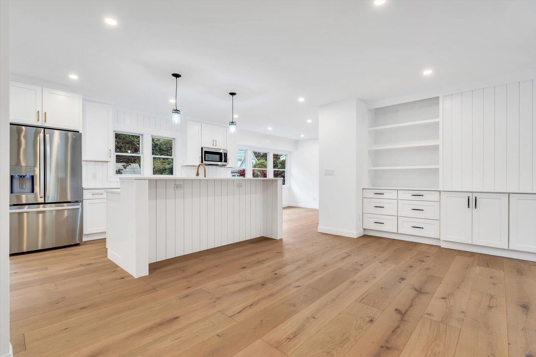 40 Sachem Drive Centerville, MA 02632 - Photo 25 of 56 a large kitchen with stainless steel appliances a refrigerator and a stove top oven