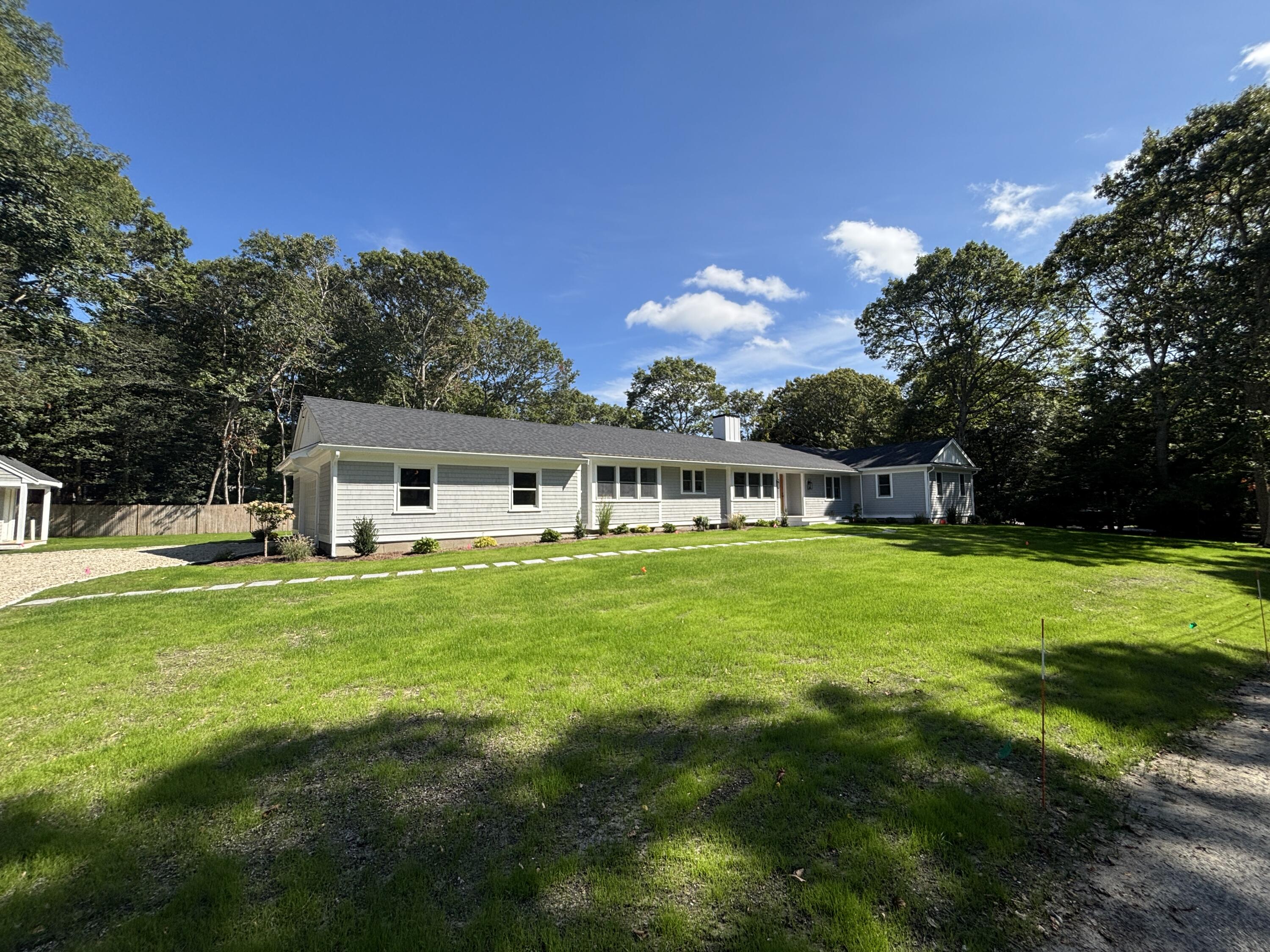 40 Sachem Drive Centerville, MA 02632 - Photo 3 of 56 a front view of a house with a garden