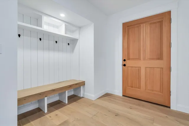 a spacious bathroom with double sink and a large mirror