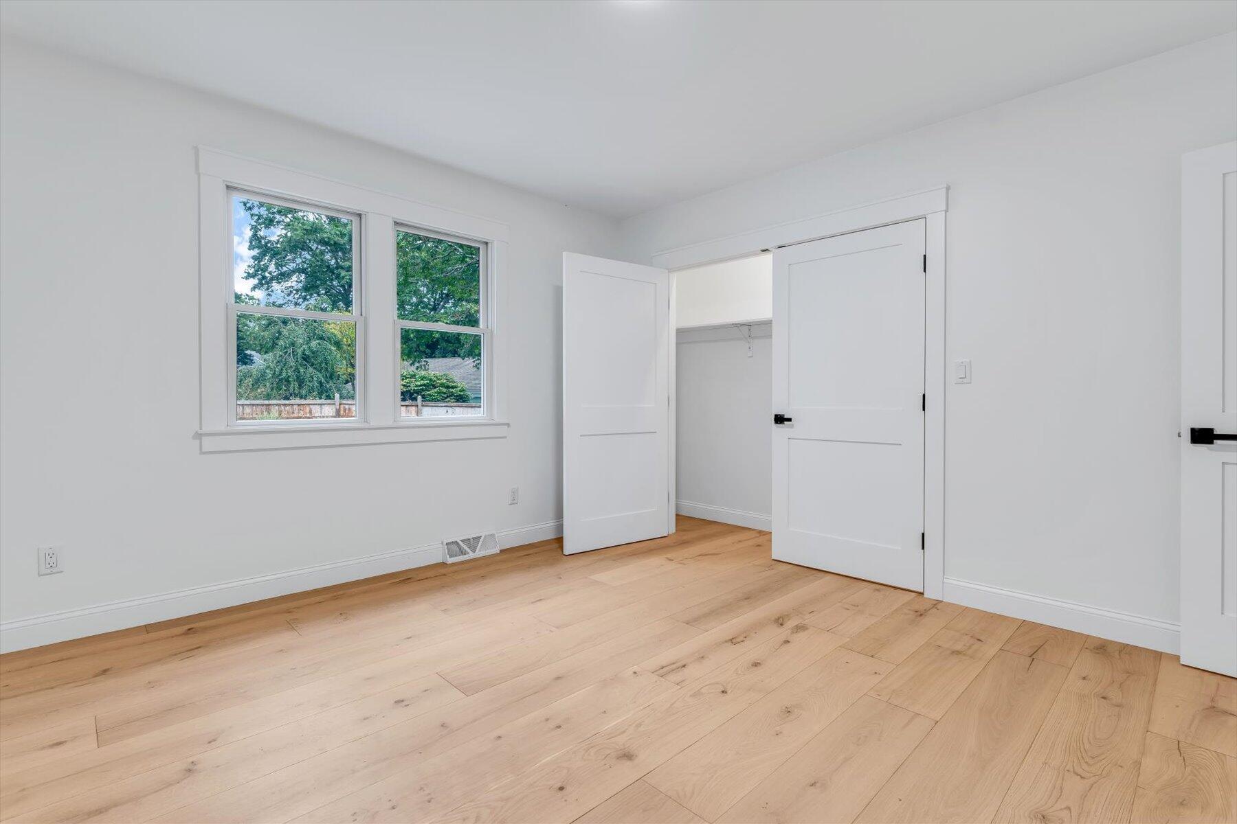 40 Sachem Drive Centerville, MA 02632 - Photo 36 of 56 a view of an empty room with wooden floor and windows