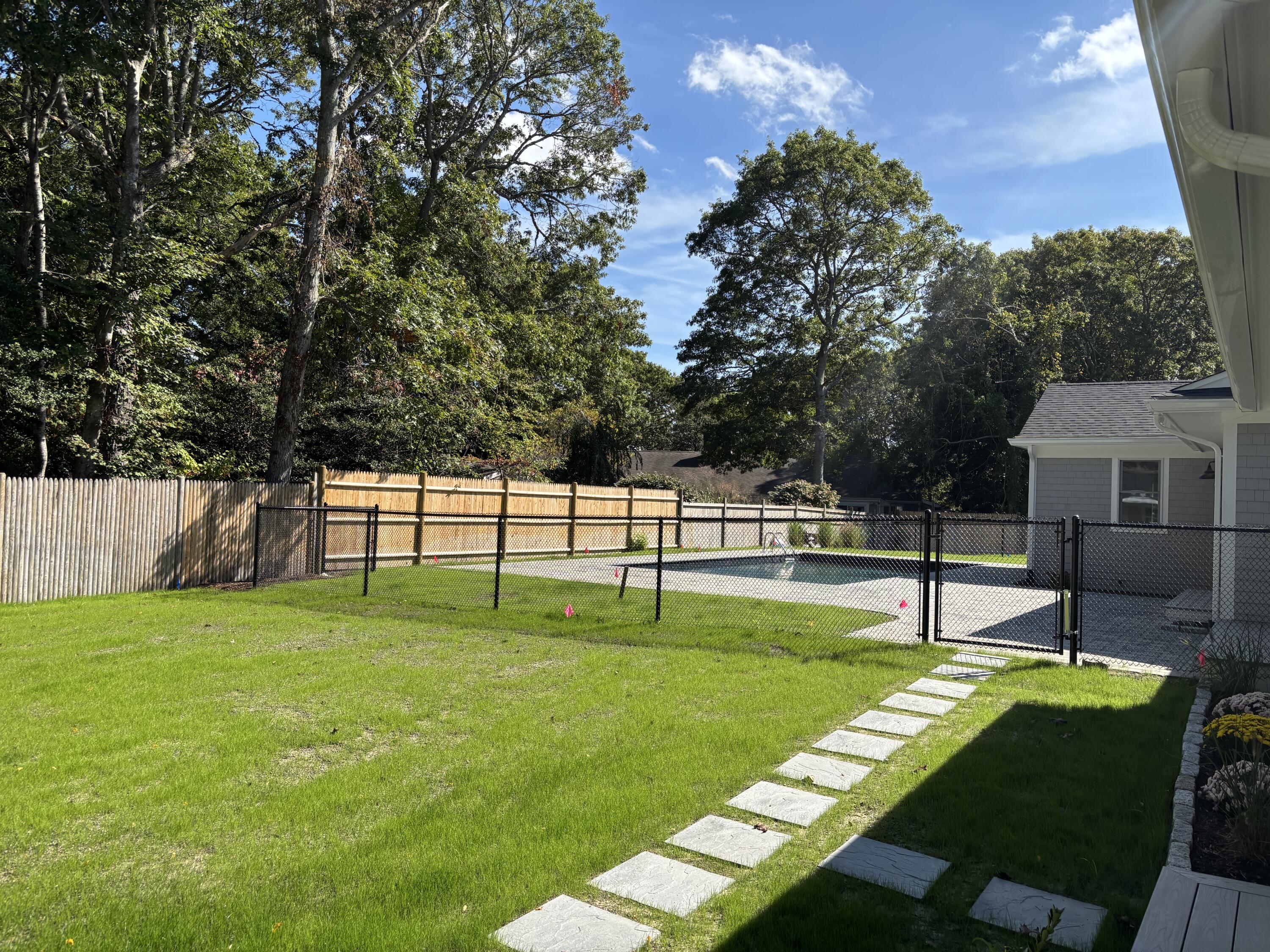 40 Sachem Drive Centerville, MA 02632 - Photo 4 of 56 a swimming pool with wooden fence