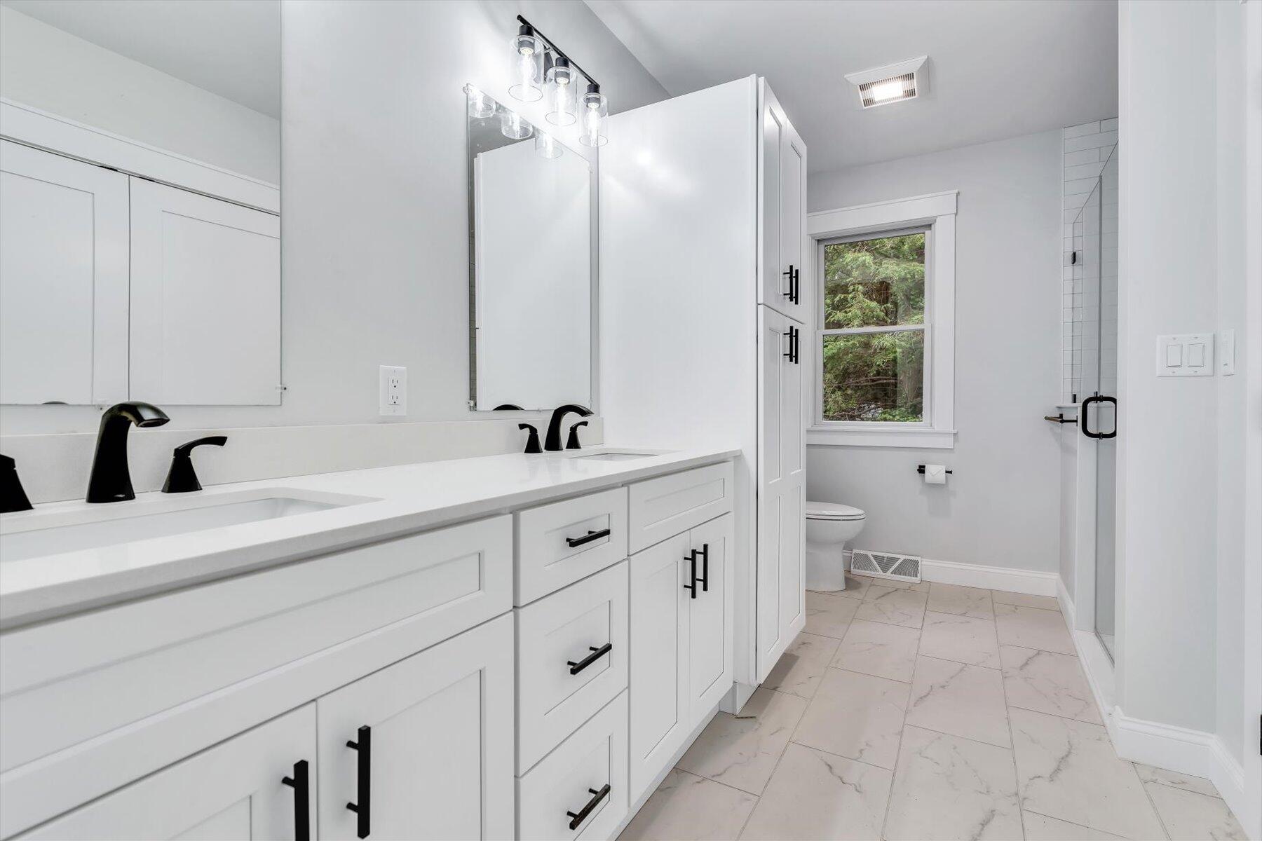 40 Sachem Drive Centerville, MA 02632 - Photo 46 of 56 a spacious bathroom with double sink and a large mirror